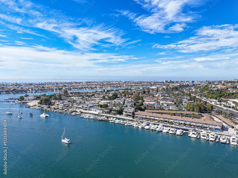 Boats docked at waterfront homes in Newport Beach, Orange County, Southern California Boats docked at waterfront homes in Newport Beach, Orange County, Southern California