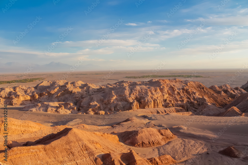 Fototapeta premium Valle de la Luna in San Pedro de Atacama desert, Chile. The Moon valley or Valley of the Moon arid soil and red rock landscape in Atacama desert