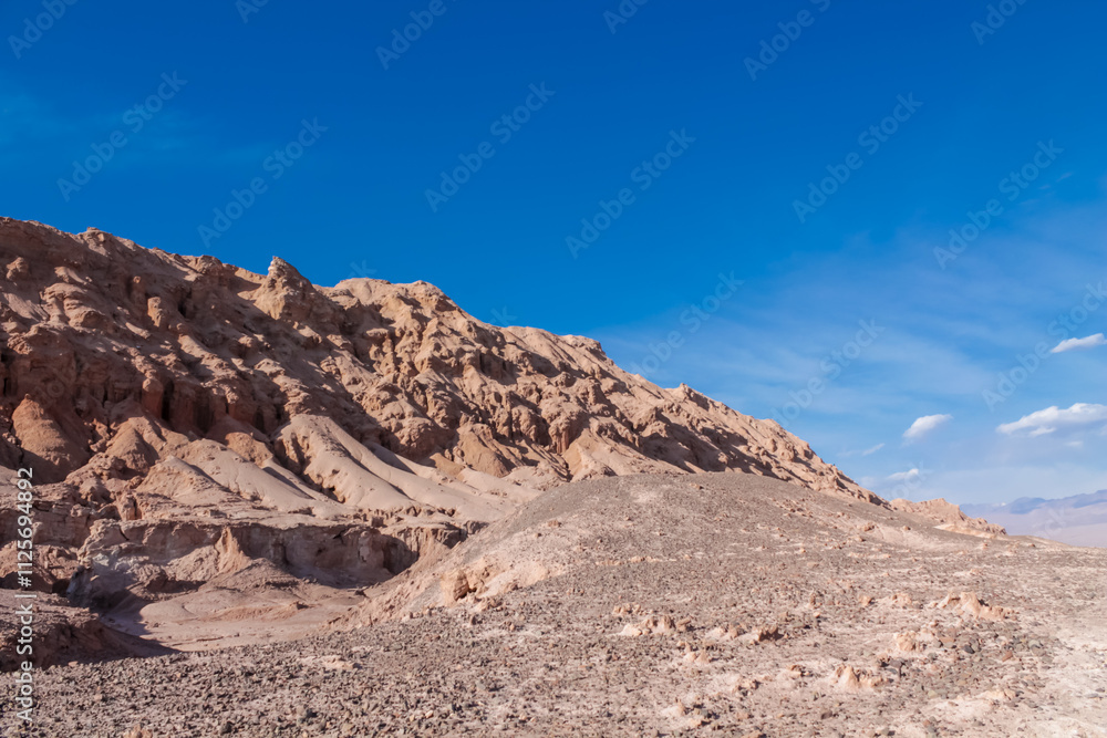 Valle de la Luna in San Pedro de Atacama desert, Chile. The Moon valley or Valley of the Moon arid soil and red rock landscape in Atacama desert Valle de la Luna in San Pedro de Atacama desert, Chile. The Moon valley or Valley of the Moon arid soil and red rock landscape in Atacama desert
