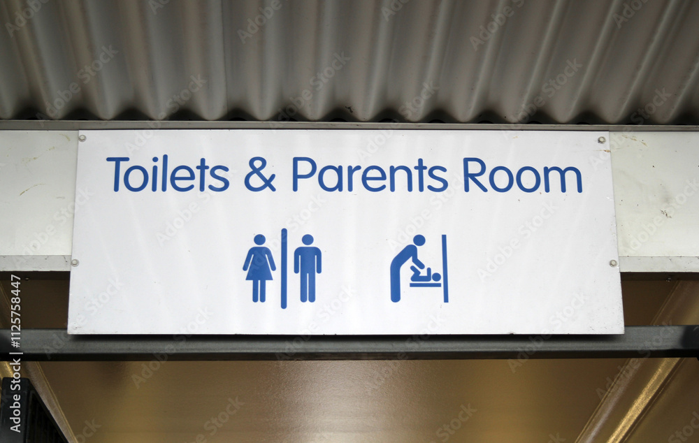 Toilets and Parents Room sign attached to a building Toilets and Parents Room sign attached to a building