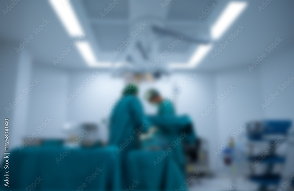 Blurred image background of medical team performing surgical operation in operating room. Blurred image background of medical team performing surgical operation in operating room.