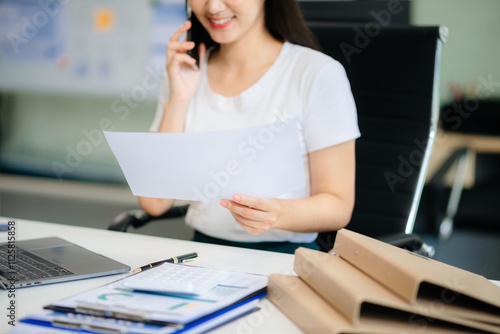 Businesswoman hand using laptop, tablet and smartphone in office.
