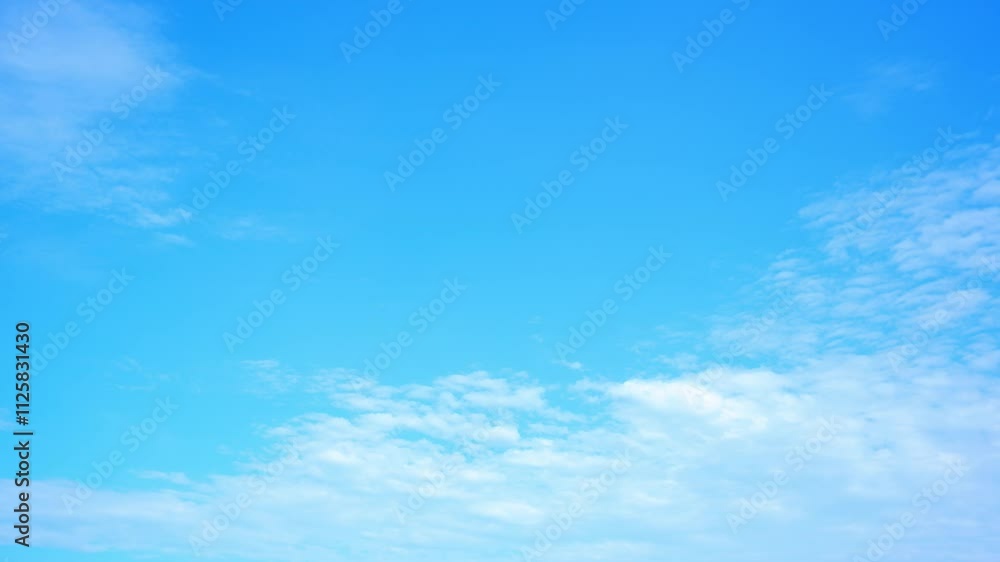 4K : A time-lapse of the fast-moving, fluffy clouds, highlighting the tranquil beauty of a sunny day. Cloud formations concept. Time lapse. Summer sky background.
4K : A time-lapse of the fast-moving, fluffy clouds, highlighting the tranquil beauty of a sunny day. Cloud formations concept. Time lapse. Summer sky background.