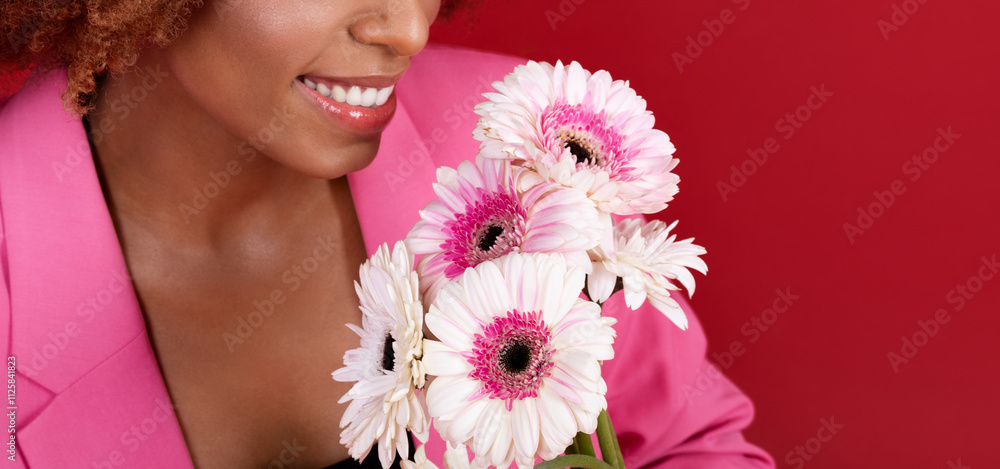 A young African American woman beams joyfully as she holds a bouquet of pink and white flowers, set against a bright red backdrop, creating a vibrant and happy atmosphere, copy space, cropped A young African American woman beams joyfully as she holds a bouquet of pink and white flowers, set against a bright red backdrop, creating a vibrant and happy atmosphere, copy space, cropped