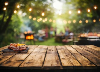 Grilled food on wooden table at summer barbecue party.