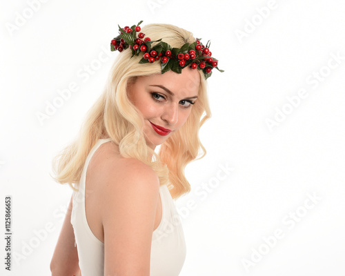 close up portrait of beautiful blonde female model wearing holly and ivy Christmas  fantasy wreath crown headdress. isolated silhouette on white studio background. photo