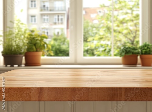 Empty wooden kitchen counter with window and plants background.