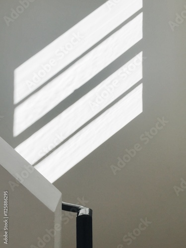 Abstract Staircase with Linear Sunlight Shadows photo