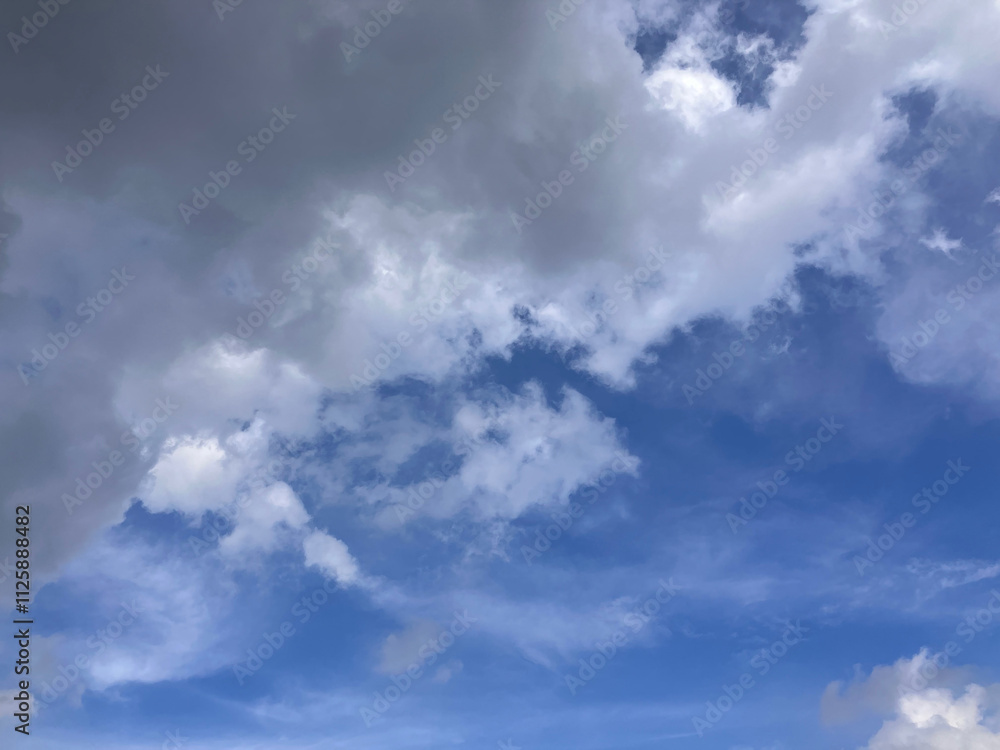Dynamic Contrast of Dark Clouds and Clear Blue Skies in a Stunning Atmospheric Display Dynamic Contrast of Dark Clouds and Clear Blue Skies in a Stunning Atmospheric Display