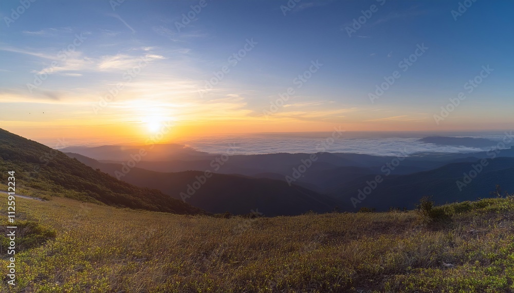 Sunset panorama over misty mountain valley Sunset panorama over misty mountain valley