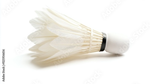 11.High-definition close-up of a single feathered badminton shuttlecock isolated on a clean white background; the shuttlecockâ€™s feathers are pristine and evenly spaced, with fine detailing on the photo