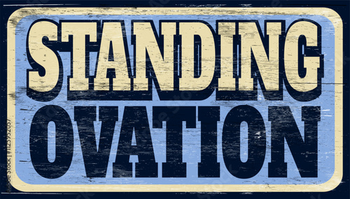 Aged retro standing ovation sign on wood