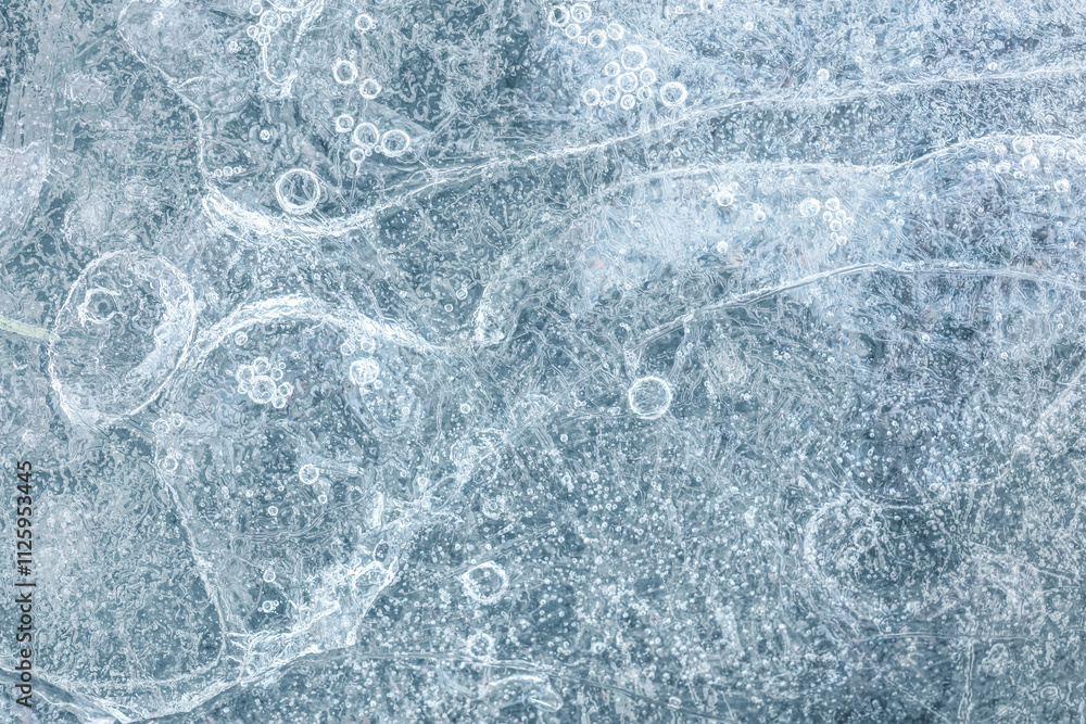 Naklejka premium frozen river water with air bubbles. frosty ice structure. macro view.