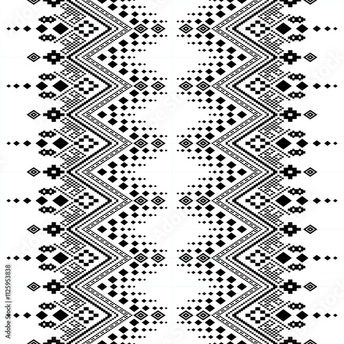 A striking black and white geometric pattern inspired by traditional ethnic art. The design features a repeating motif of diamonds, squares, and crosses, creating a bold and graphic look. 