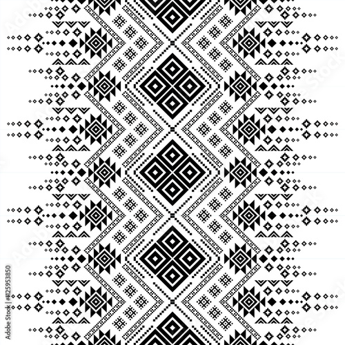 A striking black and white geometric pattern inspired by traditional ethnic art. The design features a repeating motif of triangles and squares, creating a bold and graphic look. 