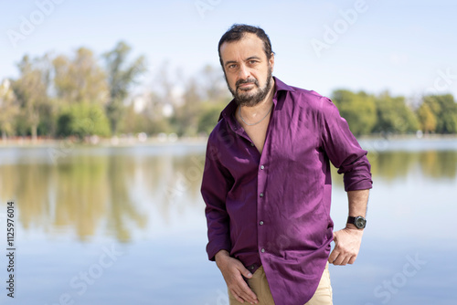 Portrait of a man in his 50s walking in a lake