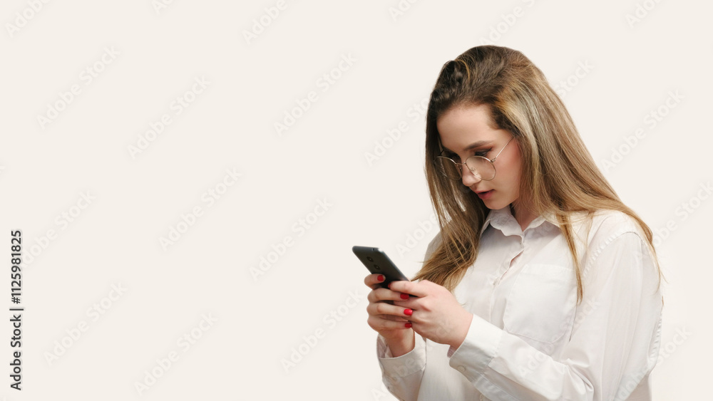 Business communication. Online chat. Assured woman in glasses texting message on smartphone isolated on white empty space background. Business communication. Online chat. Assured woman in glasses texting message on smartphone isolated on white empty space background.