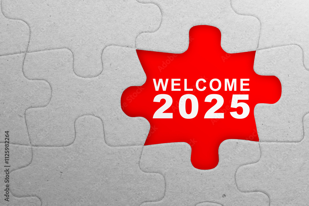 Text of welcome 2025 on the missing piece of the jigsaw puzzle with a red background Text of welcome 2025 on the missing piece of the jigsaw puzzle with a red background