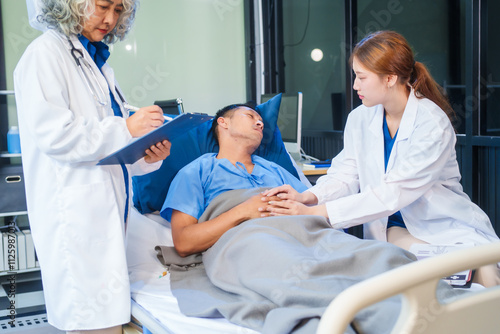 Two female doctors examine a patient lying on a hospital bed,discuss the medical chart,administer medicine,and provide encouragement, ensuring compassionate care and fostering the patient's recovery