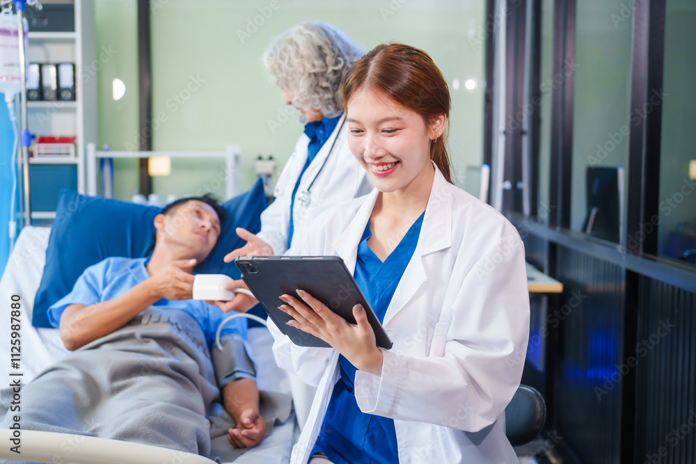 Two female doctors examine a patient lying on a hospital bed,discuss the medical chart,administer medicine,and provide encouragement, ensuring compassionate care and fostering the patient's recovery Two female doctors examine a patient lying on a hospital bed,discuss the medical chart,administer medicine,and provide encouragement, ensuring compassionate care and fostering the patient's recovery