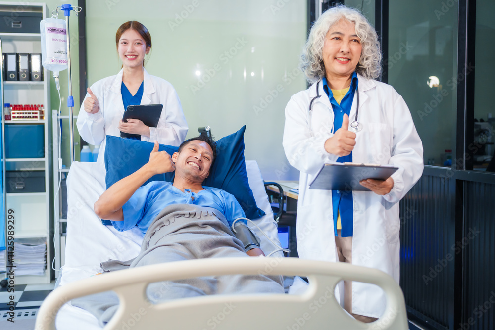 Fototapeta premium Two female doctors examine a patient lying on a hospital bed,discuss the medical chart,administer medicine,and provide encouragement, ensuring compassionate care and fostering the patient's recovery