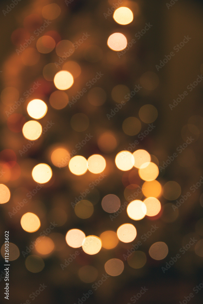 Fototapeta premium A warm Christmas bokeh background from the lights on a tree.