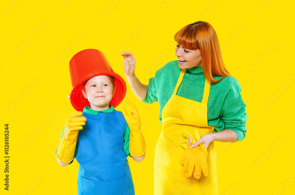 Bright and cheerful cleaning activity between child and adult in colorful outfits against a vibrant yellow background Bright and cheerful cleaning activity between child and adult in colorful outfits against a vibrant yellow background