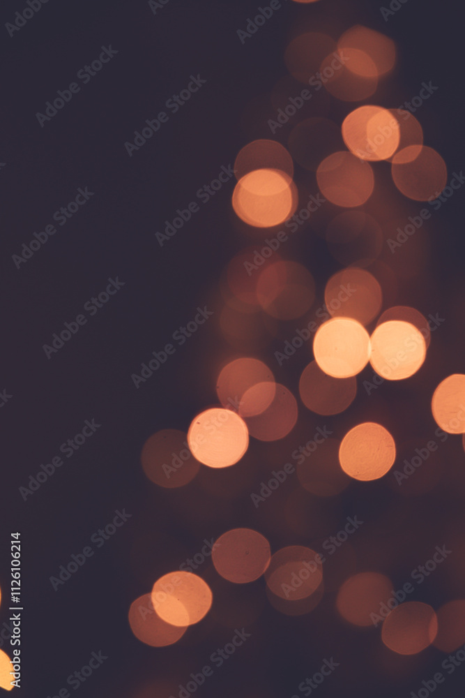 Fototapeta premium A warm Christmas bokeh background from the lights on a tree.