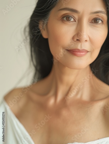 Obraz na płótnie elegant mature older woman beauty closeup studio portrait - skincare beige and white aesthetic, diverse beauty w salonie