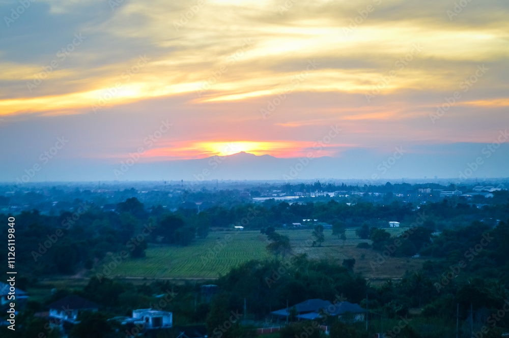 Sunset Over Mountain and Countryside Landscape view in Evening at Lamphun, Northern Thailand Sunset Over Mountain and Countryside Landscape view in Evening at Lamphun, Northern Thailand