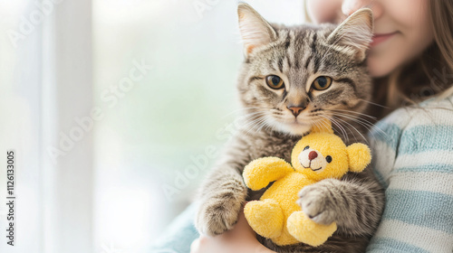 Girl Holding Kitten with To...
