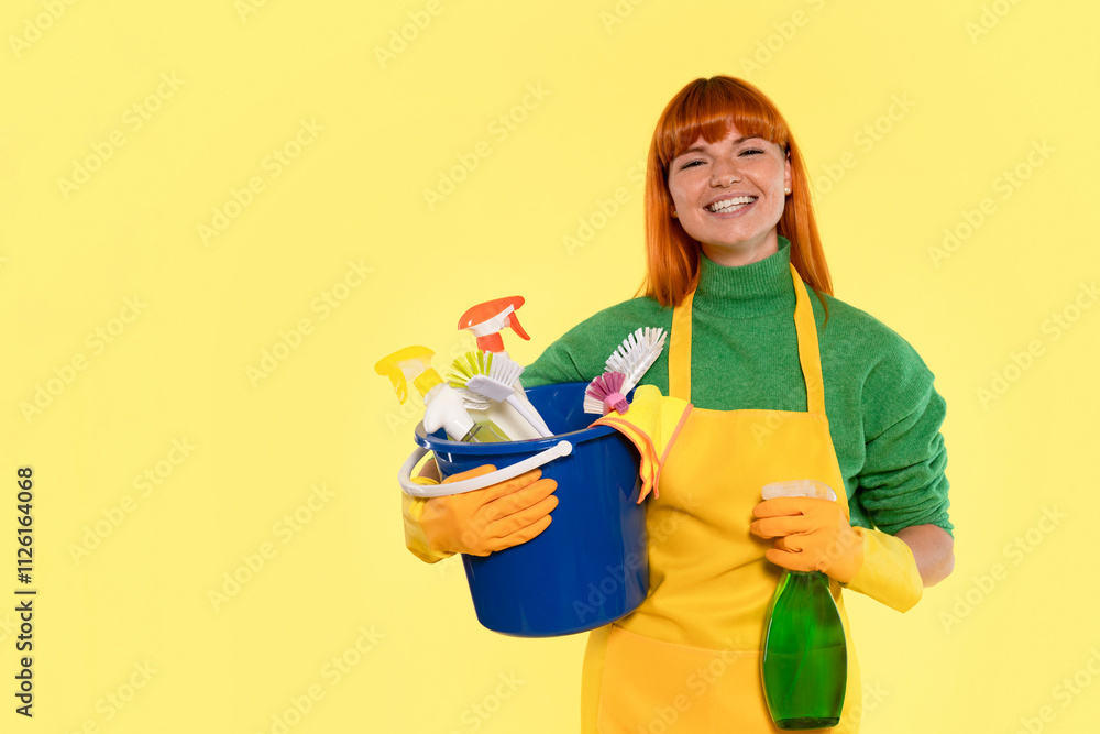 Brightly dressed woman holds cleaning supplies in a cheerful setting Brightly dressed woman holds cleaning supplies in a cheerful setting