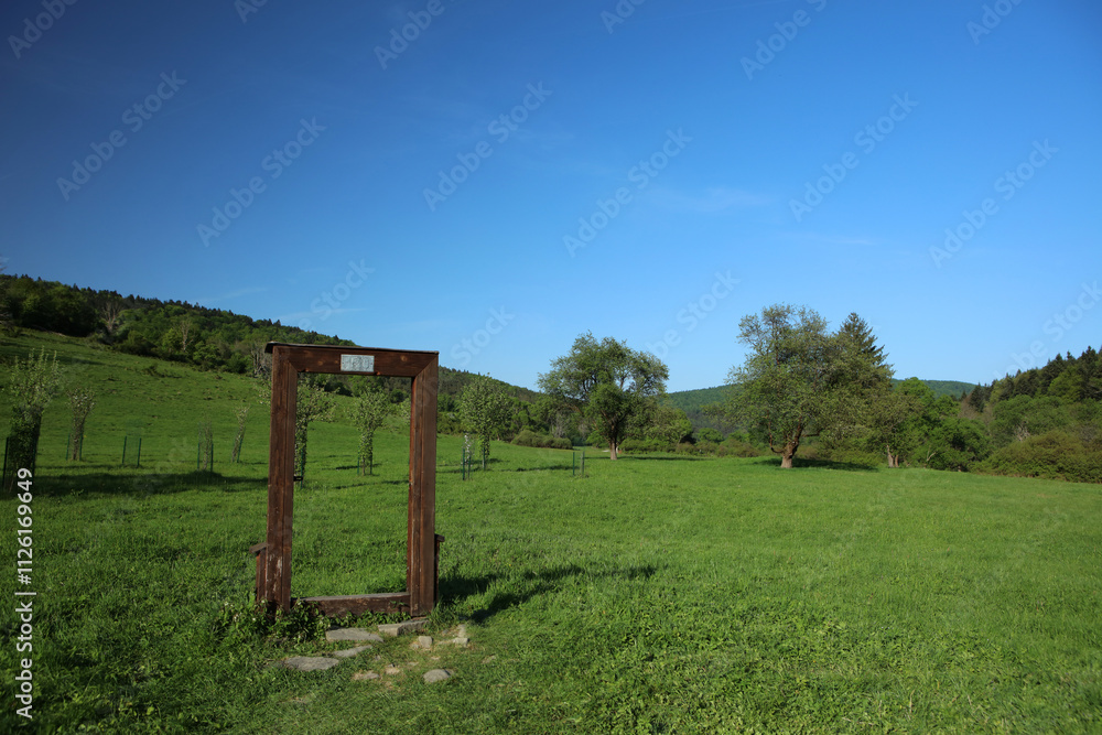 Symbolic door in former, abandoned village - Nieznajowa in Low Beskid mountain range, Poland
