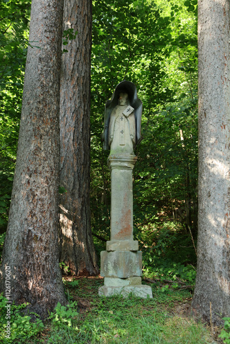 Old roadside shrine in former, abandoned village - Swierzowa Ruska in Low Beskid mountain range, Poland