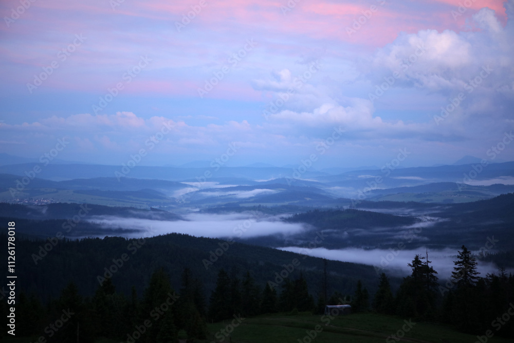 Landscape of Zywiec Beskids mountain range after sunset, view from Rysianka peak, Poland