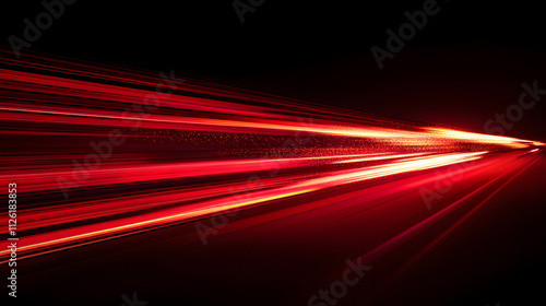 Bright red light trails creating a dynamic sense of motion against a dark backdrop in a nighttime setting