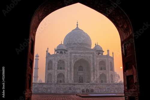Taj Mahal at sunrise framed with the arch of the mosque, Agra, Uttar Pradesh, India