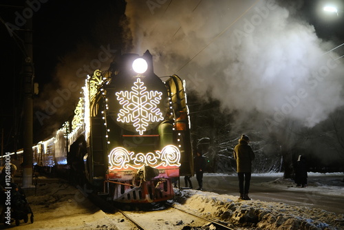 Christmas train with steam locomotive and illumination
