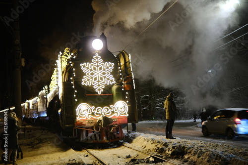 Christmas train with steam locomotive and illumination