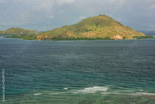 Volcanic island in Komodo Naional Park, Flores Sea, Nusa Tenggara, Indonesia photo