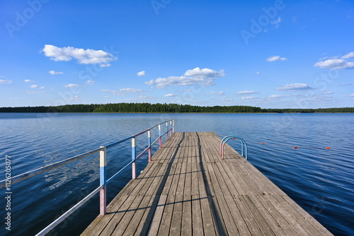 Wooden pier on the shore of Lake Svyatoe in Mugreevsky village photo