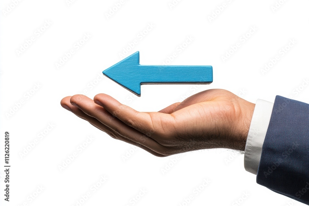 Hand presenting a blue arrow pointing left in a professional setting Hand presenting a blue arrow pointing left in a professional setting