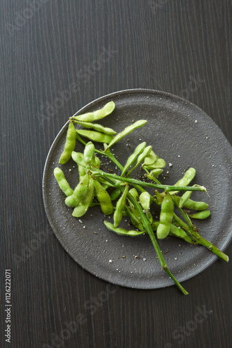 Edamame on a black plate