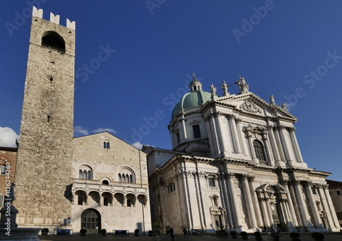 Facades of old town hall Broletto, tower Torre del Pegol, medieval house Loggia delle Grida on square Piazza Paolo VI in Brescia city photo