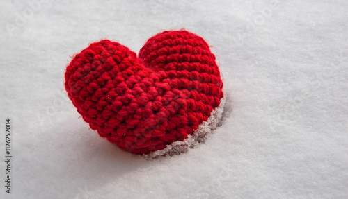 Beautiful red wool heart handmade laid in the snow