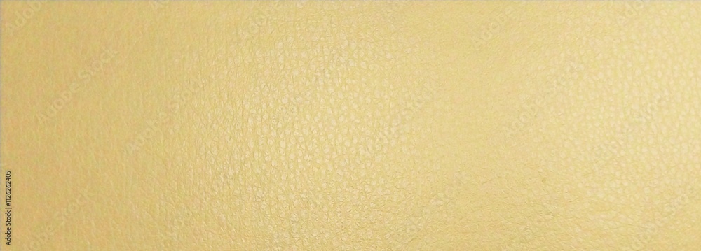 a close-up of a textured surface with a light yellow or beige color. The texture appears to be slightly grainy or pebbled, similar to a fine leather or a textured wall a close-up of a textured surface with a light yellow or beige color. The texture appears to be slightly grainy or pebbled, similar to a fine leather or a textured wall