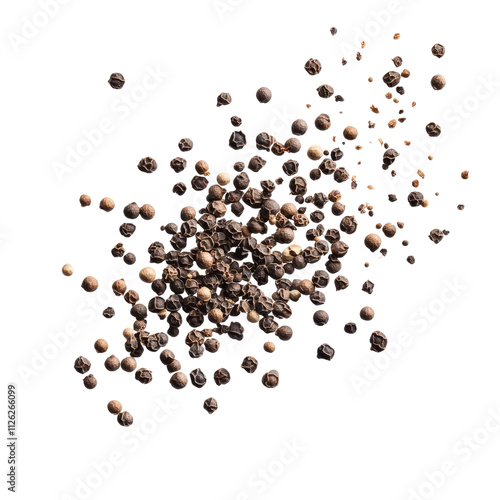 Close up of scattered black peppercorns.