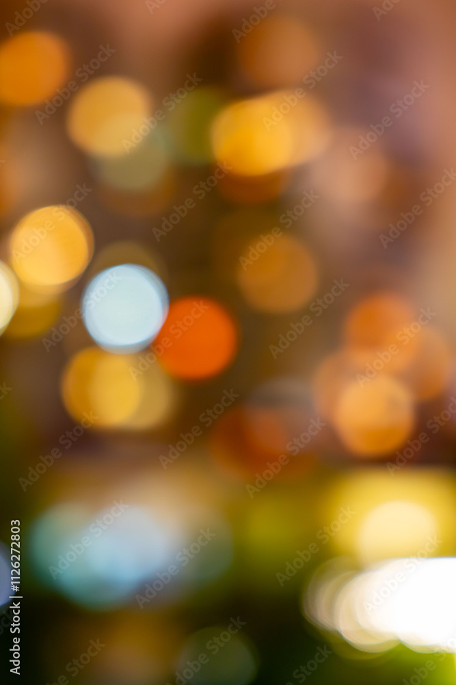 A blurry image of a cityscape with a lot of yellow and orange lights A blurry image of a cityscape with a lot of yellow and orange lights