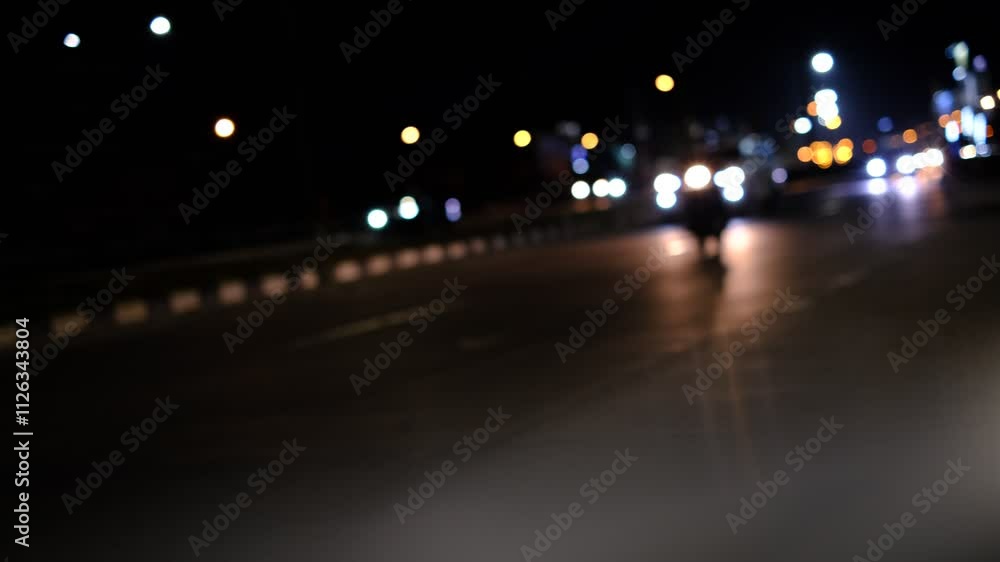 A blurry shot of a busy street at night with cars and lights. Scene is busy and chaotic, with the cars moving quickly and the lights creating a sense of movement and energy A blurry shot of a busy street at night with cars and lights. Scene is busy and chaotic, with the cars moving quickly and the lights creating a sense of movement and energy