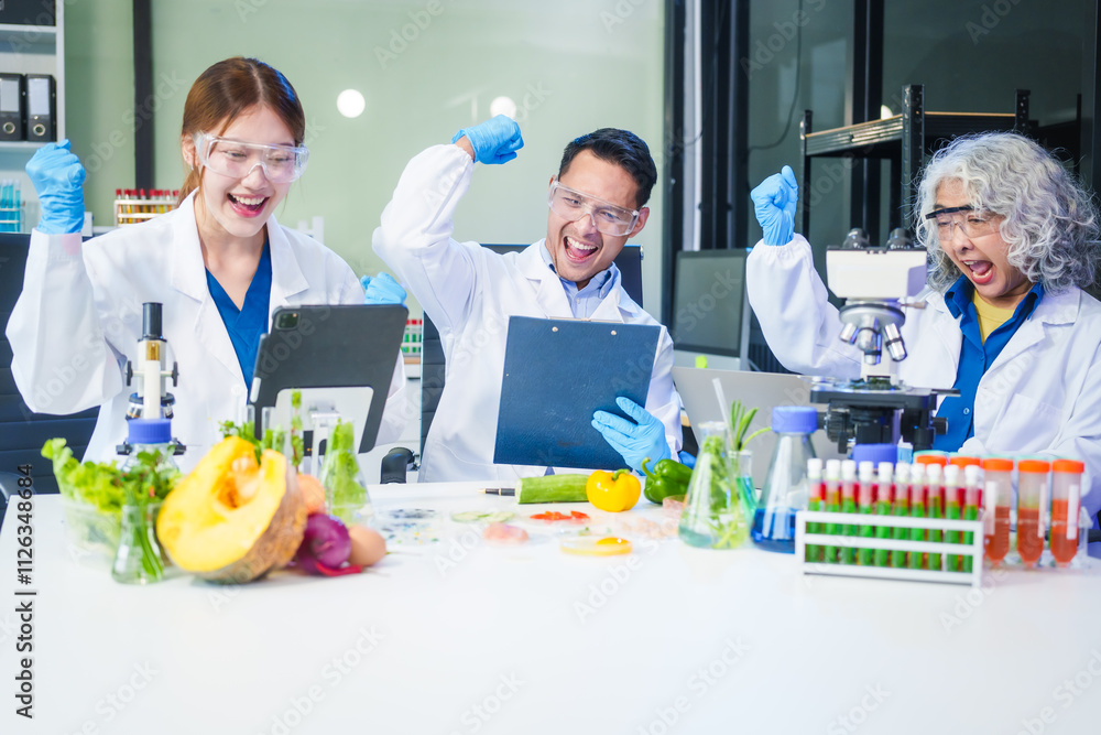 A male scientist and two women conduct plant research in a laboratory. microscopes, petri dishes,test tubes to analyze genetically modified plants, food, meat, eggs,vegetables for nutritional value A male scientist and two women conduct plant research in a laboratory. microscopes, petri dishes,test tubes to analyze genetically modified plants, food, meat, eggs,vegetables for nutritional value